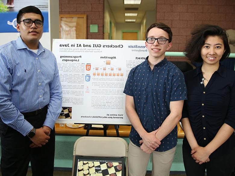 3 students with their research project